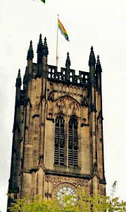 Pride flag flying above Manchester Cathedral